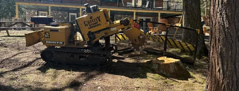 Grizzly Stump Grinding service truck in a Central New York field